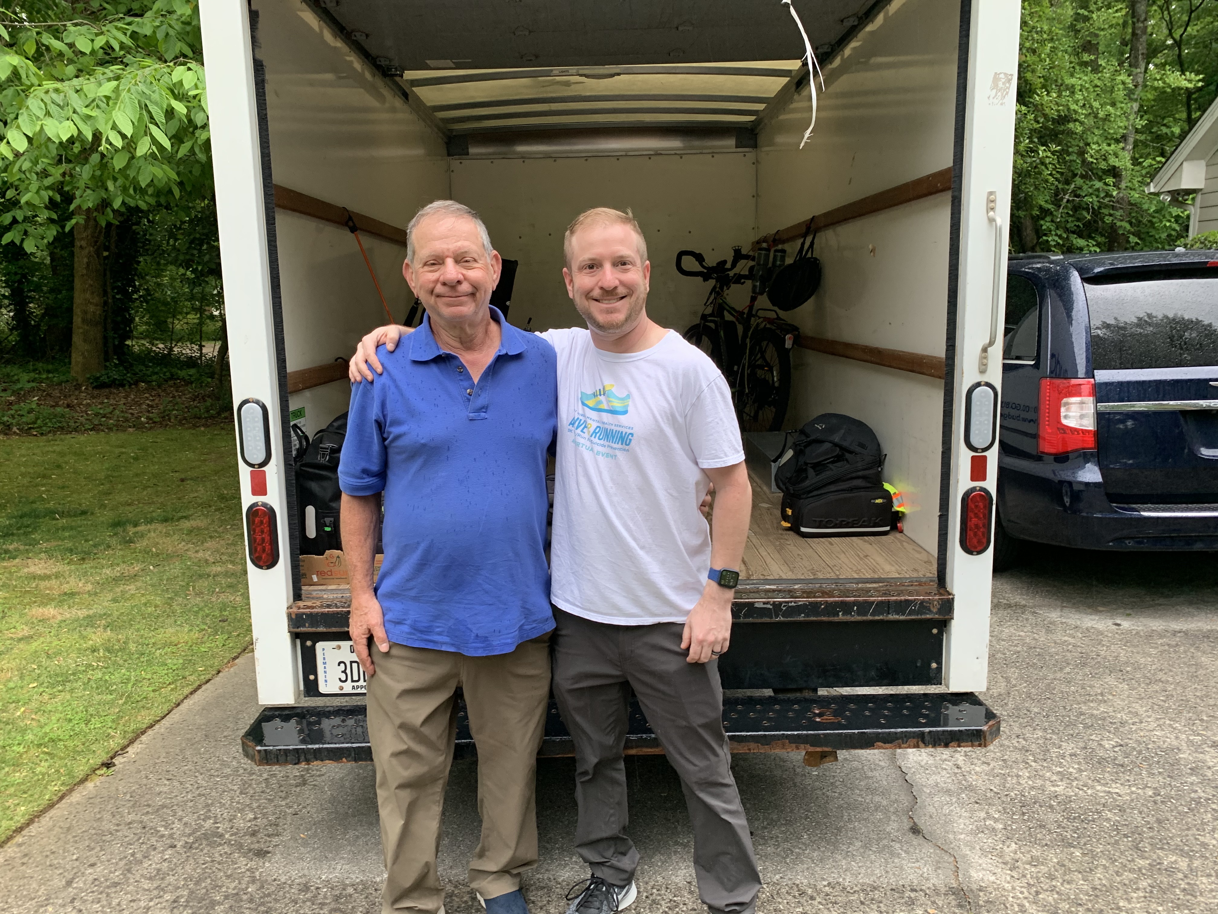 The Skotts in front of a rental van about to depart for New York.